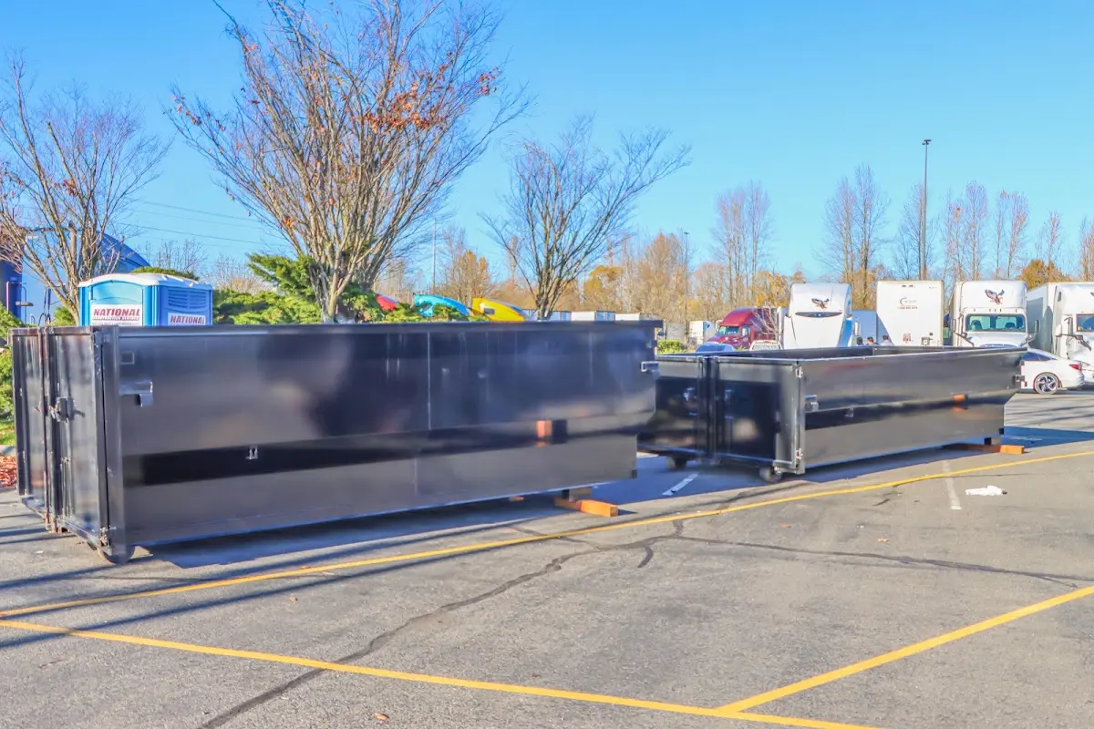 Professional dumpster rental service with roll-off container on residential driveway in Oak Lawn